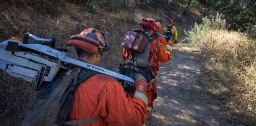 Rural counties increasingly rely on prisons to provide firefighters and EMTs who work for free, but the inmates have little protection or future job prospects